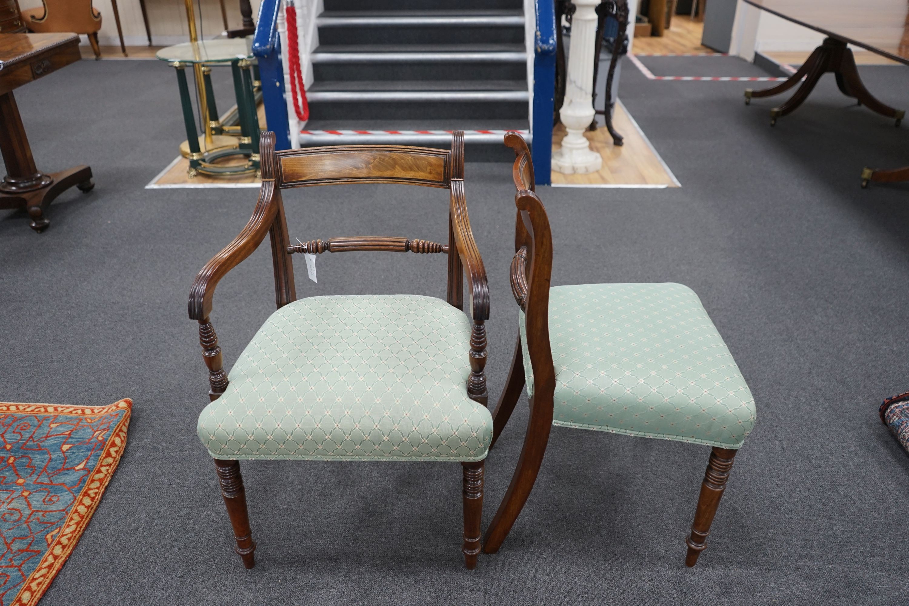 A set of eight Regency mahogany dining chairs with fluted spars, two with arms